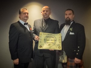 Master Olpin presented with 6th Degree Black Belt