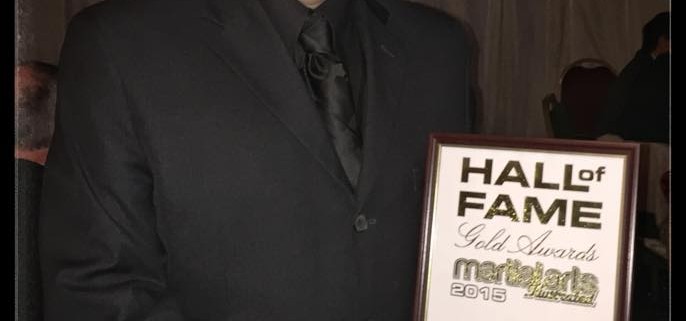 Master Olpin with his award from the MAI Hall of Fame